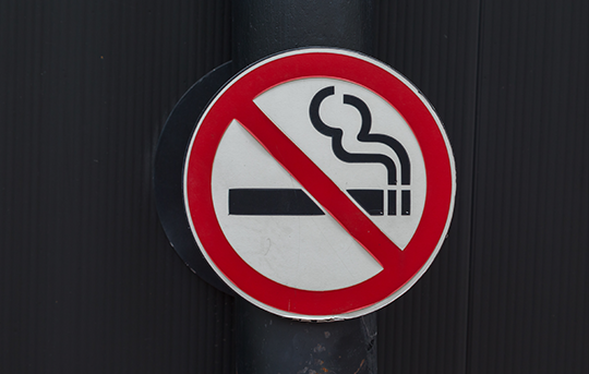 No smoking sign with a cigarette symbol crossed out in red circle.