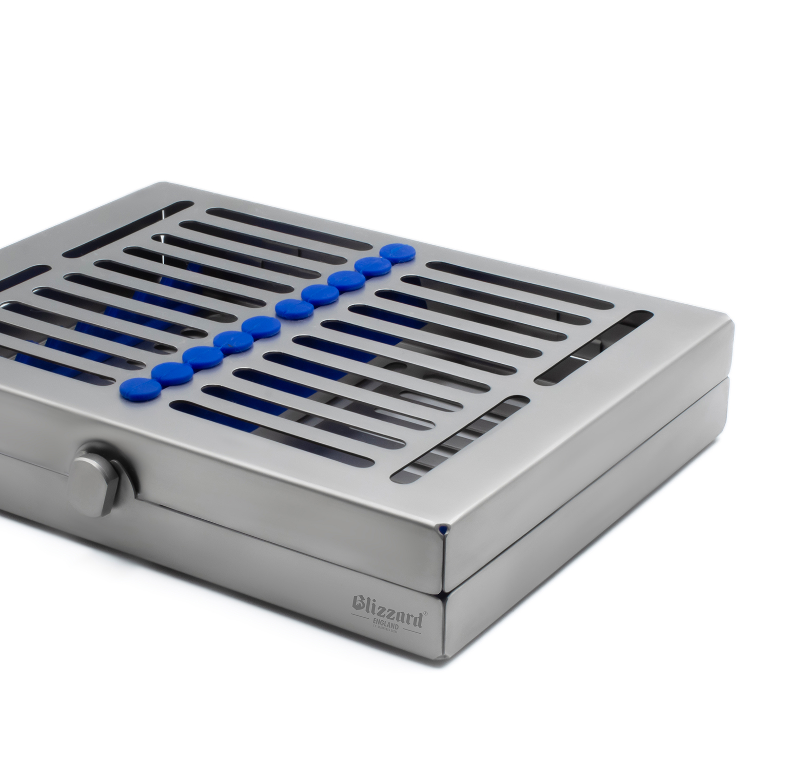 Stainless steel dental instrument cassette with slotted lid and blue silicone holders, shown on a white background.